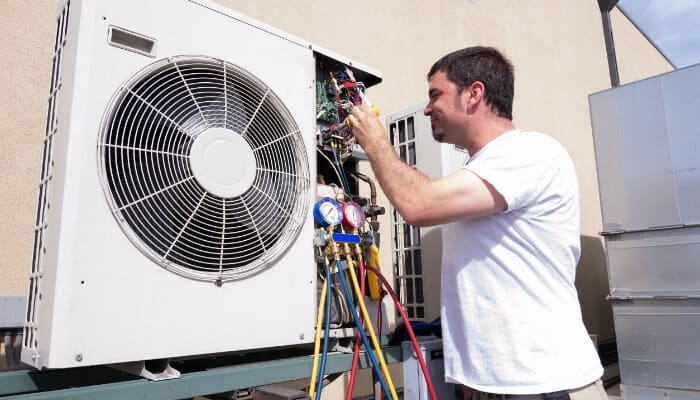 Air Conditioning Maintenance Tech Working
